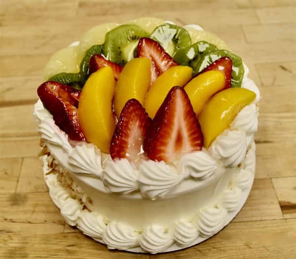 cake topped with kiwi and strawberries