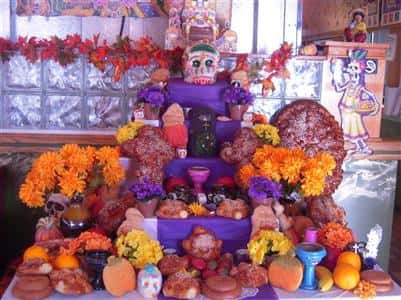 day of the dead cake decorations with skull and flowers