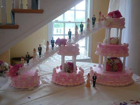 wedding cake with fake bridemaids and groomsmen