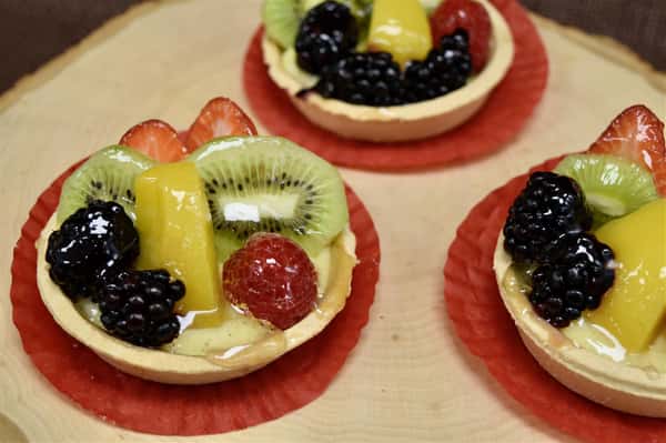 mini fruit tarts with assorted fruits and custard