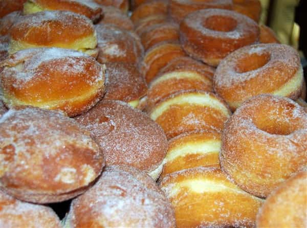 assortment of bakery donuts and rolls