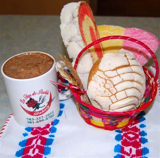 assortment of bakery cookies with a mug of hot chocolate