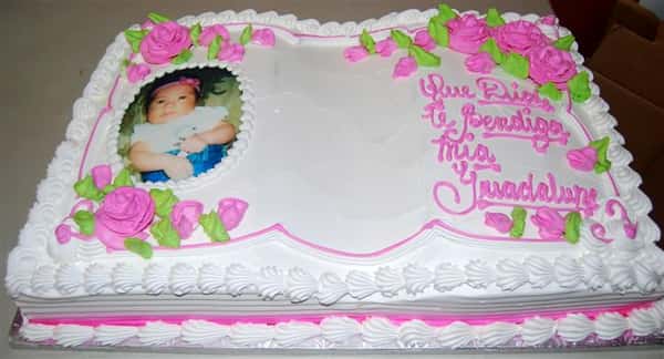 birthday cake with a child photo printed onto the top