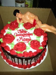 bachelorette cake with almost naked ken doll on top