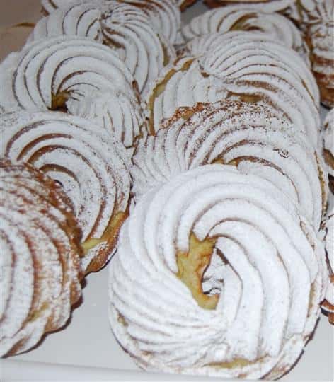 assortment of bakery cookies with powered sugar
