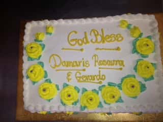 square cake with edible flowers in the middle