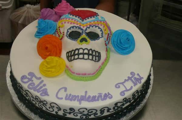 day of the dead cake with skull and flowers