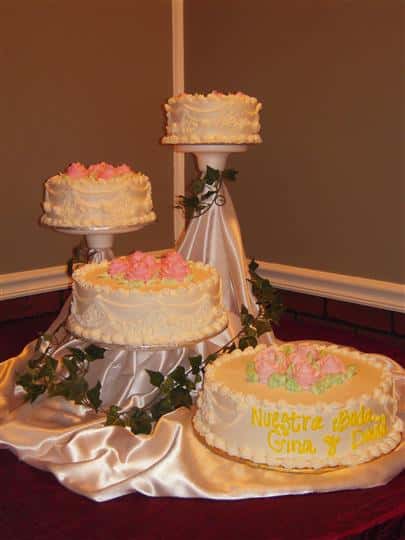 four seperate layer cakes being displayed