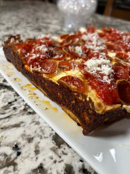 Vine-ripened peeled tomato sauce, generous amounts of spicy pepperoni with mozzarella blend and parmesan cheeses and oregano sprinkle.