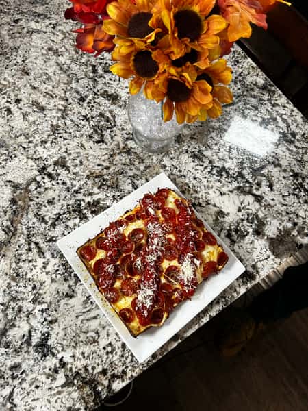 Pepperoni pizza in a table