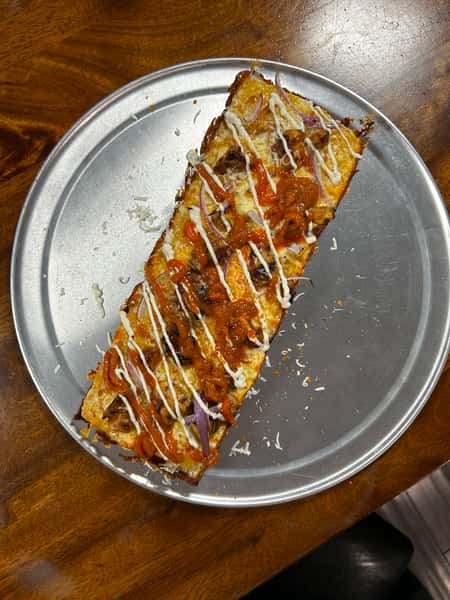 Pizza with Mozzarella blend, spicy buffalo sauce, grilled chicken, blue cheese crumbles, and ranch drizzle.