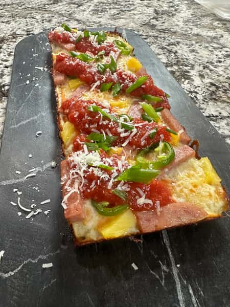 Pizza Vine-ripened peeled tomato sauce, pineapple, sliced spam (maybe ground), mozzarella blend and pickled jalapenos.