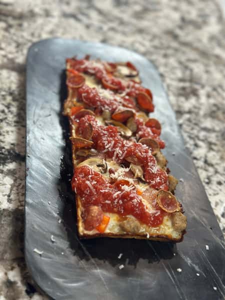 Vine-ripened peeled tomato sauce, generous amounts of spicy pepperoni with mozzarella blend and parmesan cheeses and oregano sprinkle.