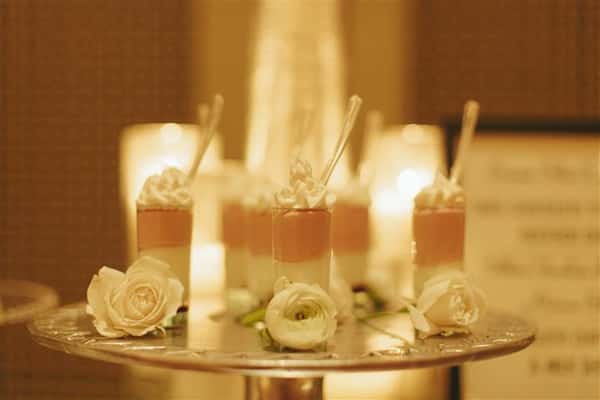 six yogurt parfaits with whipped cream on top