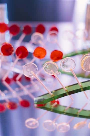 4 rows of red and clear lollipops