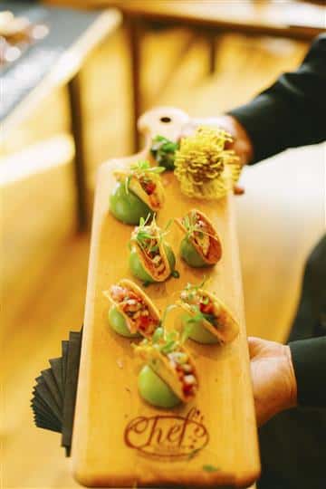 mini tacos on a wooden board