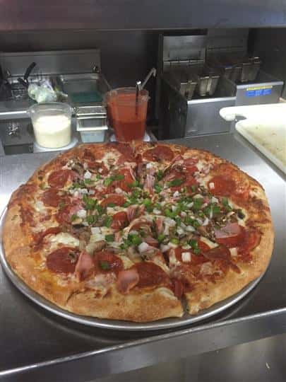 pepperoni pizza with various toppings