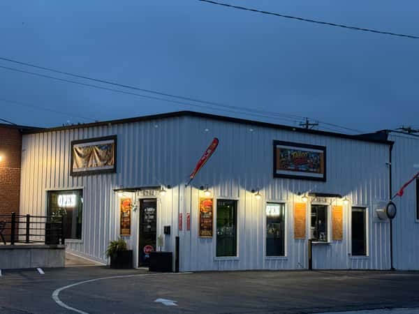 Restaurant exterior with warm lighting at night