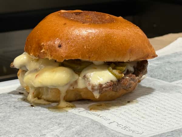 Toasted burger bun with melted cheese