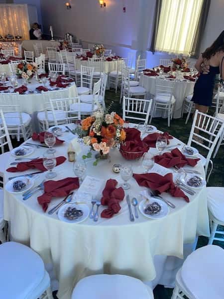 table set up for guests with flower center piece