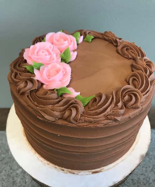 Buttercream Roses in single color on your cake (price varies on size of cake)