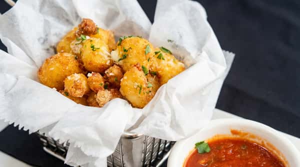 Crispy fried gnocchi topped with grated parmesan and herbs served with marinara dipping sauce.