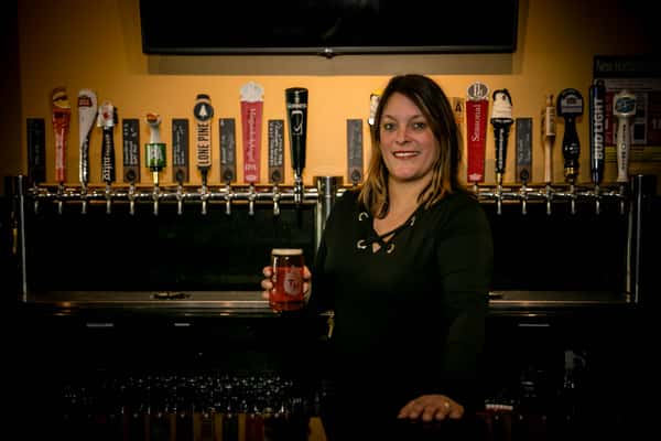 woman serving at the bar