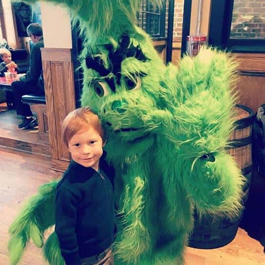 event, grinch, kid hugging grinch