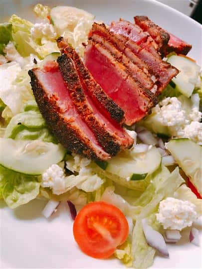 steak over lettuce