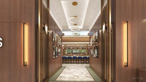 Grand restaurant entrance hallway featuring illuminated wine displays, chandeliers, and a luxurious dining atmosphere.