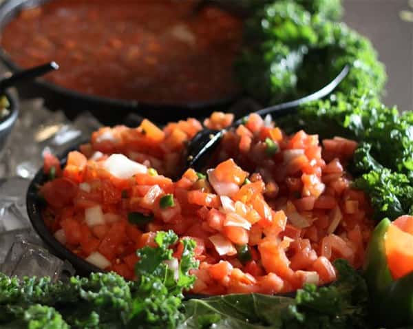 Salsa dip over a bed of lettuce