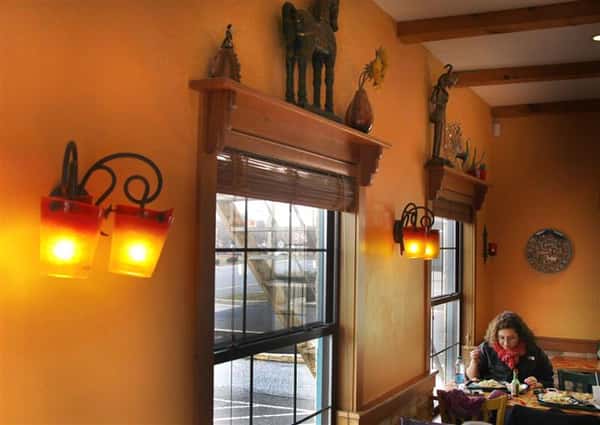 Interior dining hall with tables by the windows