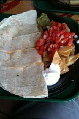 Soft tortillas and tortilla chips served with salsa and cream