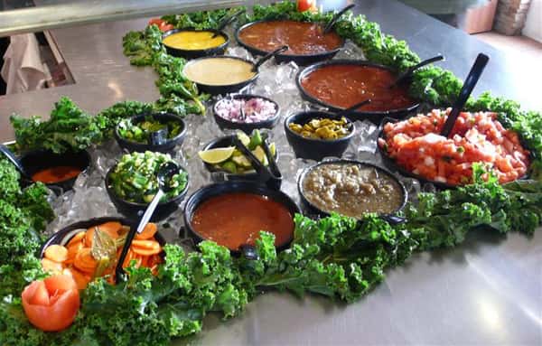 Mexican style food laid out buffet style