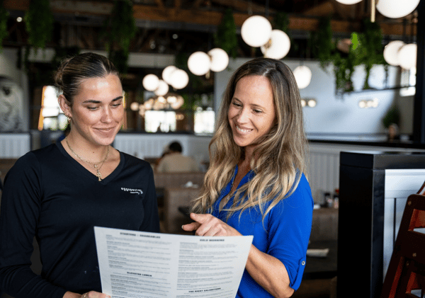 Franchise owner talking with an employee