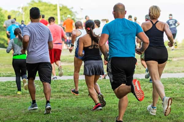 group of people running outdoor race