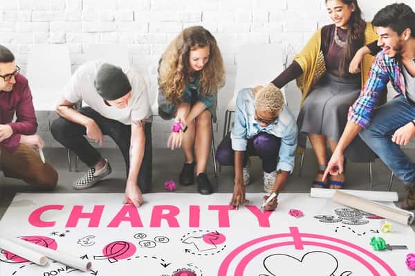 People working on Charity poster