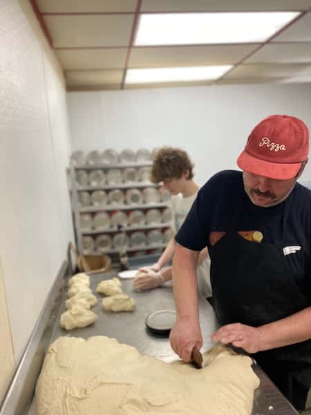 staff preparing pizza