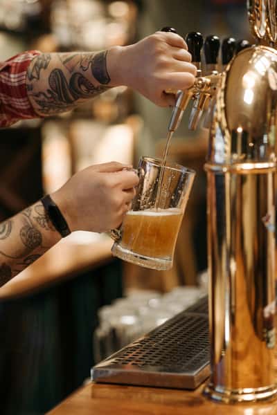 filling up beer from the beer tap