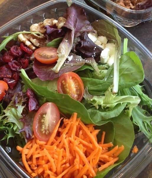 Mesclun Greens salad with cherry tomatoes, mushrooms, walnuts, cranberries, and carrots