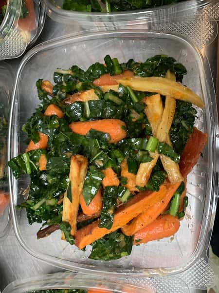 Carrot and kale slaw in a to-go container