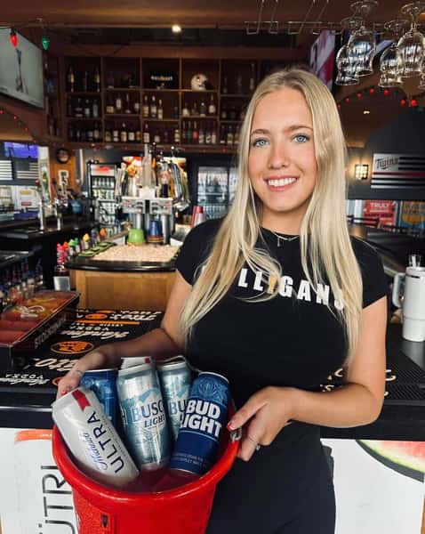 a woman holding beer