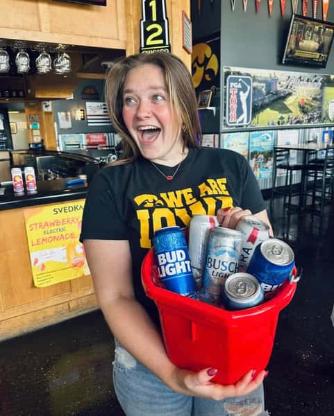 a woman holding beer
