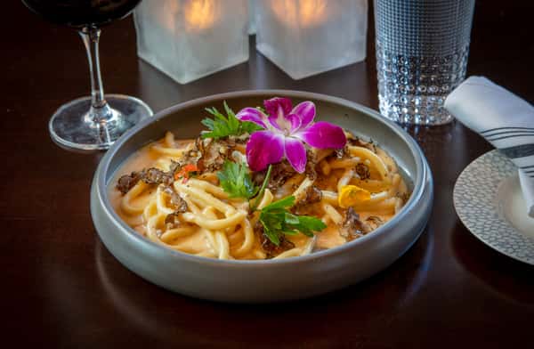 Creamy seafood pasta with shrimp, mussels, mushrooms, and fresh herbs at Dulivia Ristorante Italiano in Springdale, Utah.