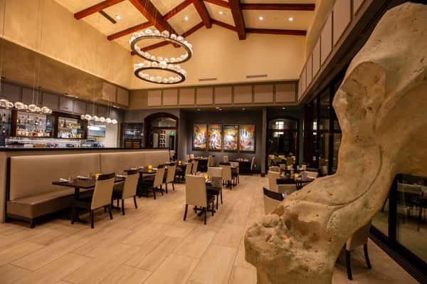 Spacious upscale dining room at Dulivia Ristorante Italiano in Springdale, Utah, featuring elegant décor, warm ambiance, and comfortable seating for Italian dining.