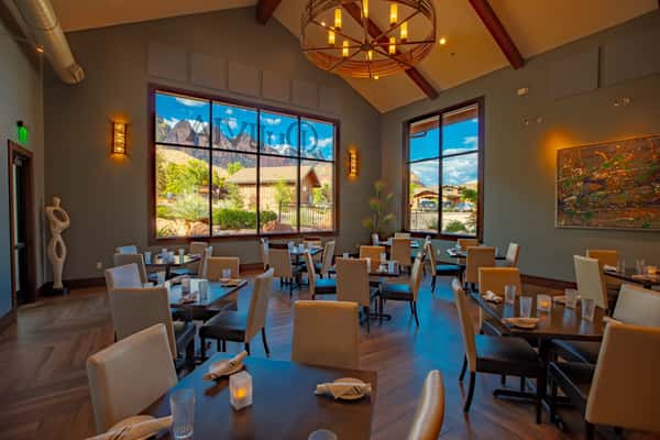 Elegant private dining room at Dulivia Ristorante Italiano in Springdale, Utah, featuring warm lighting, mountain views, and an upscale setting for private events and special occasions.
