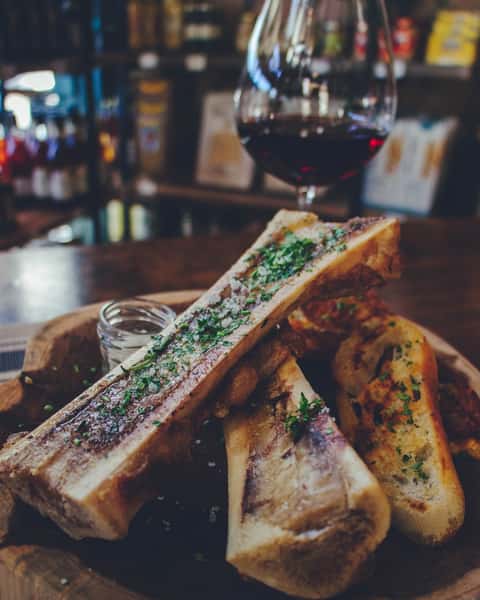 Rich, roasted bone marrow, bubbling in the bone and finished simply with parsley and sea salt.

Spread it over a grilled baguette while it’s still warm; silky, savory, and almost impossibly indulgent. The crisp bread gives way to that deep, buttery richness, bite after bite.

Primitive in the best way. Elegant in the French way.

Os à Moelle de Mamie, not a dish for restraint.

#frenchrestaurant  #houstontexas #ricevillage  #riceuniversity #winebar
