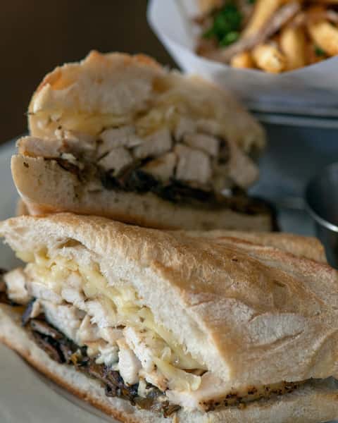 Le Suprême
Grilled chicken breast, caramelized onions, roasted cremini mushrooms, and melted Swiss on a crisp baguette. Comforting, golden, and unmistakably French-café satisfying.

#frenchrestaurant  #houstontexas #ricevillage  #riceuniversity #winebar