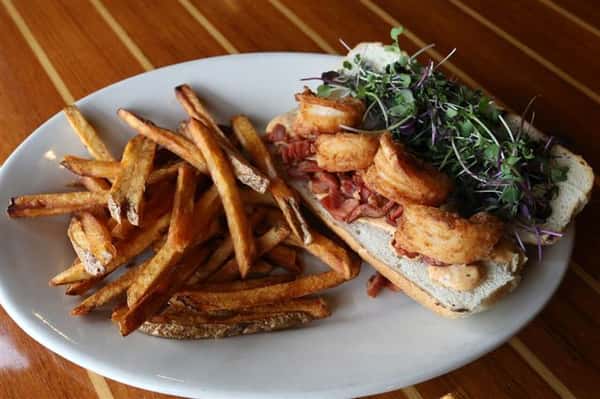 Po-Boy - Fried shrimp & country ham with our house-made Cajun tartar topped with fresh micro greens