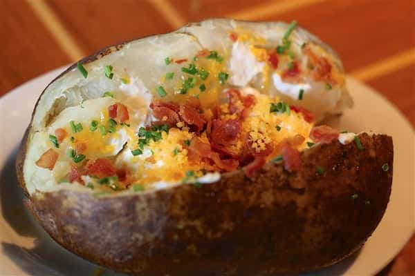 Loaded Baked Potato with chives, bacon, cheddar and sour cream.